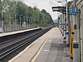 Southward view from Platform 1, with a Thameslink Class 700 approaching from Hassocks.