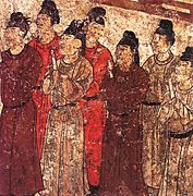 Tang dynasty mural of eunuchs holding a hu.