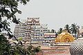 Image 24The golden Vimana over the sanctum at Srirangam midst its gopurams, its gable with Paravasudeva image. (from Tamils)