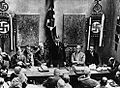 Image 12Adolf Hitler (standing) delivers a speech in February 1925. (from 1920s)