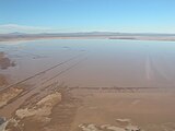 Rogers "Dry" Lake at Edwards AFB isn't always dry. Shuttle landing strip and the world's largest compass rose are visible.