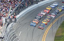 Cars being driven on an auto racing track