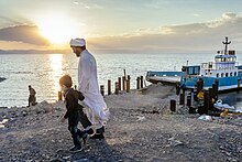 People visiting a boat on Lake Urmia