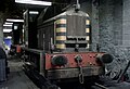 Class 01 (no. 01002) inside Holyhead Breakwater shed in early black livery. Withdrawn no. 01001 is just visible at the rear.