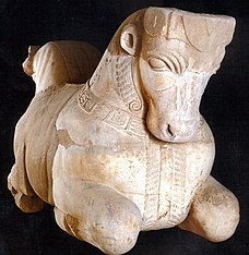 Three quarters view of a column capital adorned with the shape of a bull's head