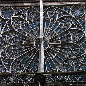 The north transept rose window (early 15th century) with a stone bar added to secure it.