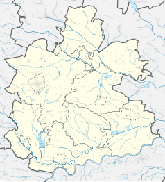 Mapa konturowa powiatu buskiego, po prawej nieco na dole znajduje się punkt z opisem „Bazylika św. Marcina w Pacanowie”