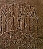 En stenrelief visande assyriernas plundring av Susa 649 f.Kr.