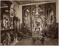 Drawing room of Henry Gibson (c. 1870), Philadelphia, Pennsylvania. The Neo-Grec center table is now in the collection of the Detroit Institute of Arts.[7]