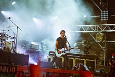 Joe Duplantier playing a guitar in 2018