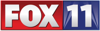 The Fox network logo in silver on a red rectangle; next to it, a silver 11 on a blue background with silhouetted searchlights.