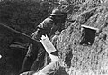 A Romanian soldier in an observation post in a trench in Ivești, 1917