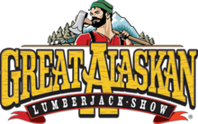 The logo features in the background trees next to a mountain. In the foreground, there is a lumberjack wearing a green hat and a red shirt and holding an axe. The bottom half of the photo features the show's logo, "Great Alaskan Lumberjack Show".