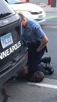 George Floyd neck knelt on by police officer.png