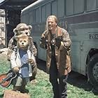 Beary (foreground, left) finds new friends in the Bears' manager, Henry (background left), and Roadie (M.C. Gainey, right). 