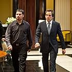 Ben Stiller and Michael Peña in Tower Heist (2011)