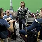 Robert Downey Jr., Chris Evans, Joss Whedon, and Chris Hemsworth in The Avengers (2012)