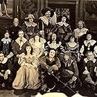 Douglas Fairbanks, Léon Bary, Nigel De Brulier, Marguerite De La Motte, Sidney Franklin, Thomas Holding, Boyd Irwin, Barbara La Marr, Mary MacLaren, Adolphe Menjou, Eugene Pallette, Mary Pickford, Lon Poff, Willis Robards, George Siegmann, and Charles Stevens in The Three Musketeers (1921)