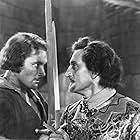 Errol Flynn and Basil Rathbone in The Adventures of Robin Hood (1938)