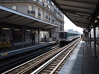 A train arriving at Passy metro station