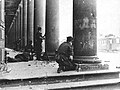 1944 - Warsaw Uprising: Germans and Ukrainians attacking Town Hall and Blank Palace from behind columns of Teatr Wielki at Theater Square