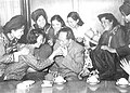 Mao Zedong with female representatives of Democracy Youth League of China (later renamed to the "Communist Youth League of China") 3rd National Representative Conference, in 1957