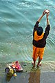 Offering Arghya, a ritual offering, to the Ganges, Varanasi.