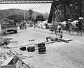 Royal Engineers prepare to blow up a bridge in Malaya during the British retreat to Singapore. In the background Chinese rickshaws loaded with rice from abandoned government stocks are crossing the bridge. The Allied forces under General Arthur Percival surrendered to General Yamashita in Singapore on 15 February 1942 after a Japanese campaign in Malaya lasting nearly 70 days