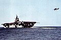 USS Hancock (CV-19) recovers a Grumman F6F "Hellcat" fighter, circa 1944.