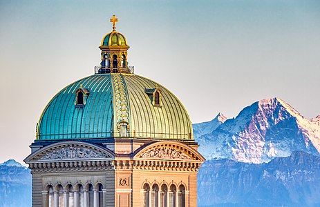 "Bern_Federal_Palace_Central_Dome_with_Eiger_2019-10-16_18-28_(cropped).jpg" by User:Andrew J.Kurbiko