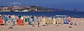 Playa de San Lorenzo. Cimadevilla y puerto de El Musel al fondo.