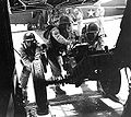 Members of the 504th Parachute Infantry Regiment prepare a weapon for stowage aboard a glider in April, 1943.