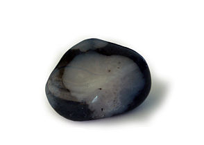 A polished snowflake obsidian on a white background