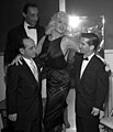 Jayne Mansfield with jockeys Johnny Longden, Eddie Arcaro and Willie Shoemaker, 1957