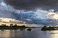 65 Blue and orange clouds over the Mekong with a pirogue running in the water at sunset in Don Det Laos uploaded by Basile Morin, nominated by Basile Morin,  14,  0,  0