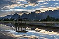 52 Water reflection of a wooden hut with colorful sky and karst mountains in a paddy field at sunset Vang Vieng Laos uploaded by Basile Morin, nominated by Basile Morin,  12,  0,  0