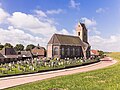 Zicht op de Mariakerk van Wierum vanaf de zeedijk.