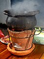 Chim chum is a Thai hot pot with a herbal broth served in an earthen pot