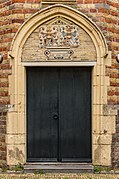 Back of the Martena House. Wooden door.