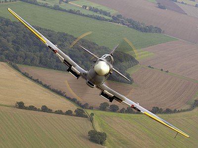 Air to air image of a Spitfire, taken over RAF Coningsby. MOD 45147974