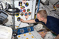 Continuing a longstanding tradition, astronaut Eric Boe, Pilot for STS-126, adds his crew patch in the Unity node.