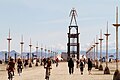 The Man and participants on Promenade. Burning Man 2010.