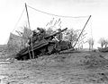 2nd Armored Division, tank destroyer on dug-in ramp has plenty of elevation to hurl shells at long range enemy targets across the Roer River