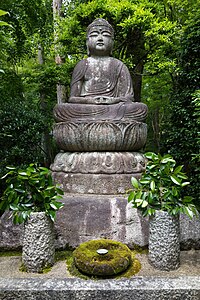 "Stone_statue_of_the_Buddha_seated_with_moss-covered_stone_alms_bowl_in_Ryōan-ji_Zen_Buddhist_temple_Ukyō-ku_Kyoto_Japan.jpg" by User:Basile Morin