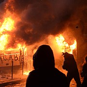 Radically oriented protesters throwing Molotov cocktails in direction of Interior troops positions. Dynamivska str. Euromaidan Protests. Events of Jan 19, 2014-3 (cropped).jpg