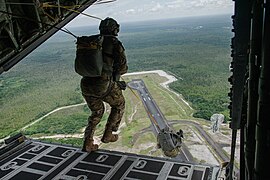 Tactical air control party specialists with the 137th Special Operations Wing, Oklahoma National Guard, conduct a static line jump.jpg