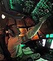 Staff Sgt. checks fuel tank levels from the flight deck of a C-130 Hercules aircraft at Little Rock Air Force Base, Ark.