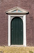 Wooden door in front Museum Hindeloopen South side.