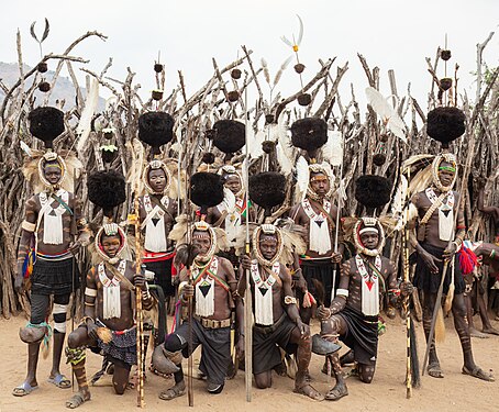 Group of Lopit men in traditional costumes, Imehejek, South Sudan.