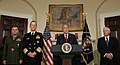 President of the United States George W. Bush (at lectern) introduces Admiral Michael Mullen (second from left) and General James E. Cartwright (far left) as his nominees to be Chairman and Vice Chairman of the Joint Chiefs of Staff, respectively. Secretary of Defense Robert Gates stands alongside Bush.